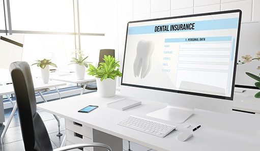Dental insurance form on desktop in office
