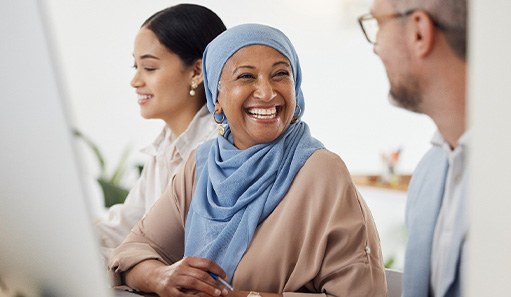 Woman smiling at coworker in office