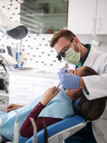 Dentist treating dental patient
